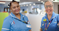 Two nurses who completed their Registered Nurse Degree apprenticeships